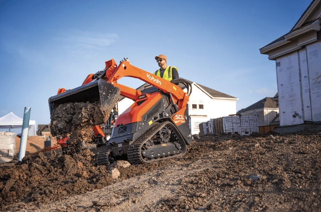 Man operating on stand-on loader
