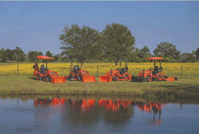 Kubota tractor lineup on a scenic field