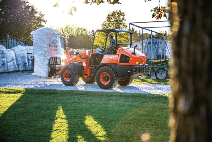A Wheel Loader moving a pallet of material