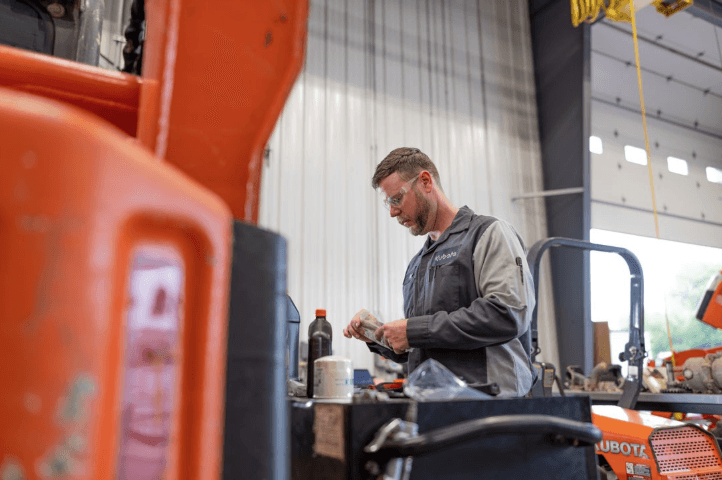 Kubota technician working on equipment