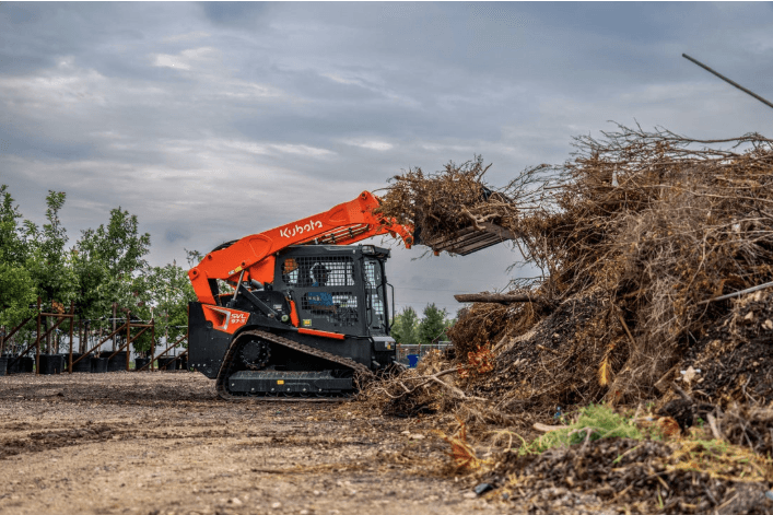 Track Loader loading debris onto a pile