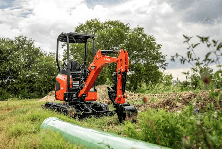 Excavator moving pipes