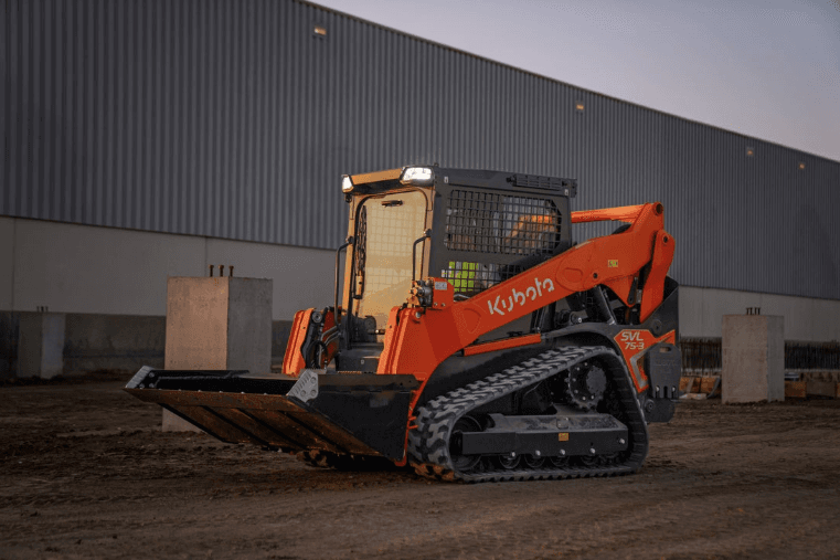 Track Loader outside a warehouse