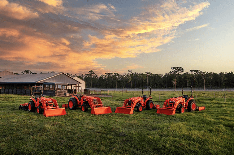 Line up of tractors in a field
