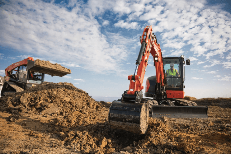Excavator digging a trench